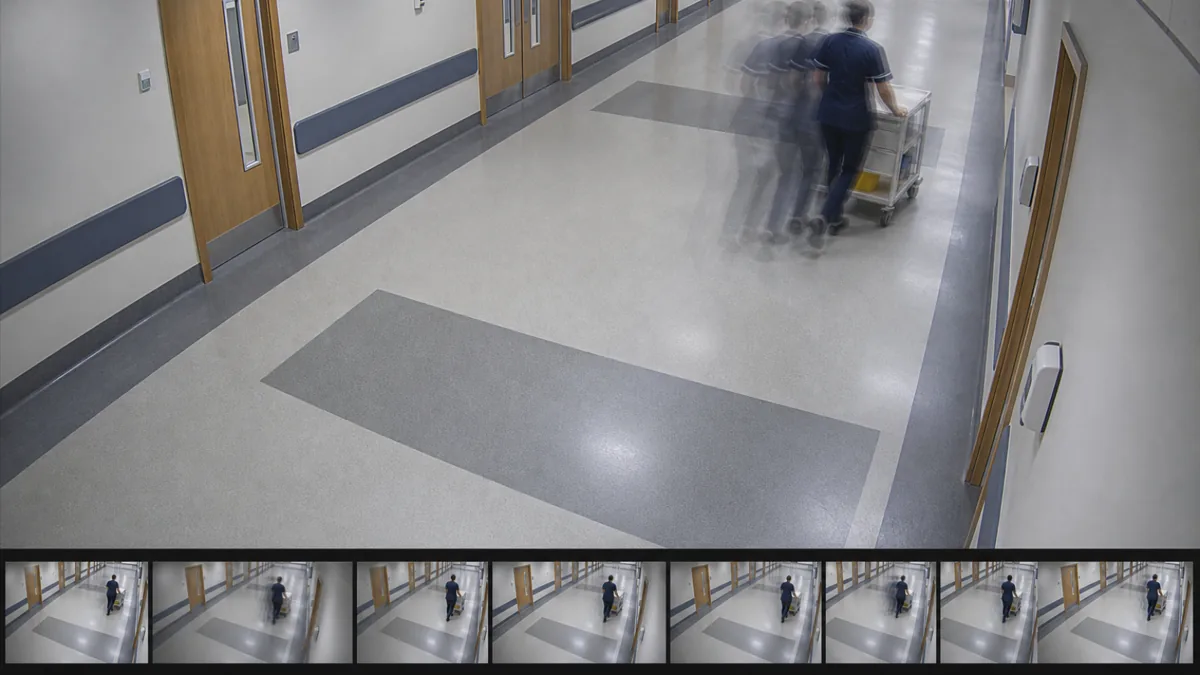 FPS drift degradation in a hospital corridor CCTV view, with ghosted trolley movement and skipped-frame cues.
