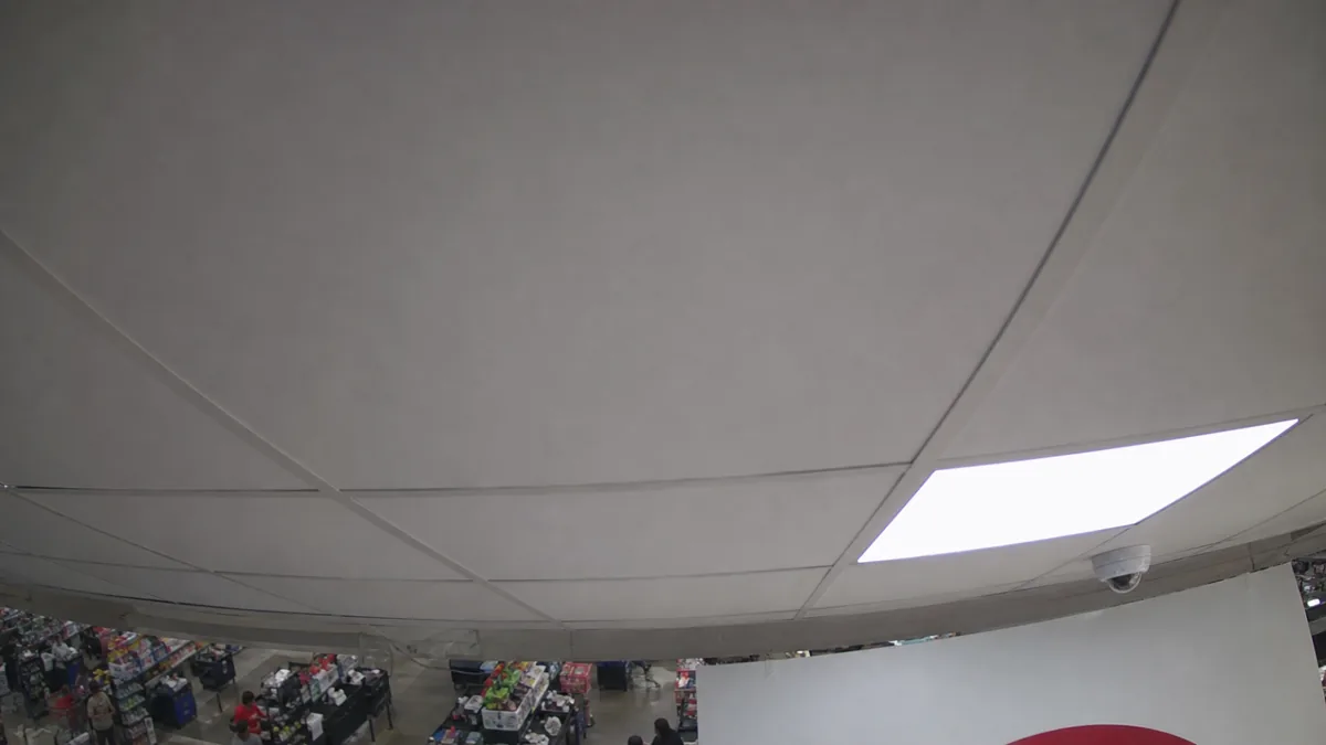 Scene change degradation in a retail checkout CCTV view, where the camera points mostly at the ceiling.